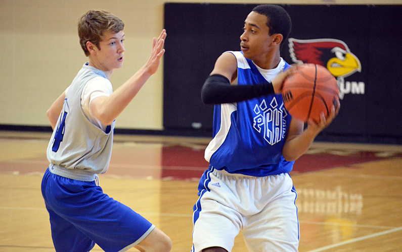 Polk County rising freshman Kendal Wilkins looks for a teammate during Monday's play.