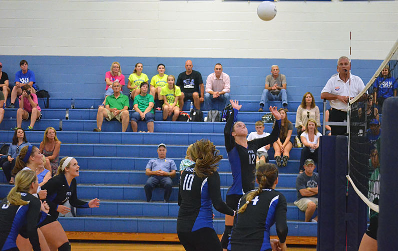 All Polk County eyes are on Sarah Phipps as the senior prepares for a kill during Tuesday's match.