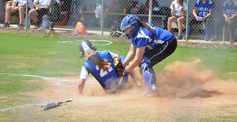 Polk County's Autumn Owen is tagged out at  home during the third inning of Saturday's game.