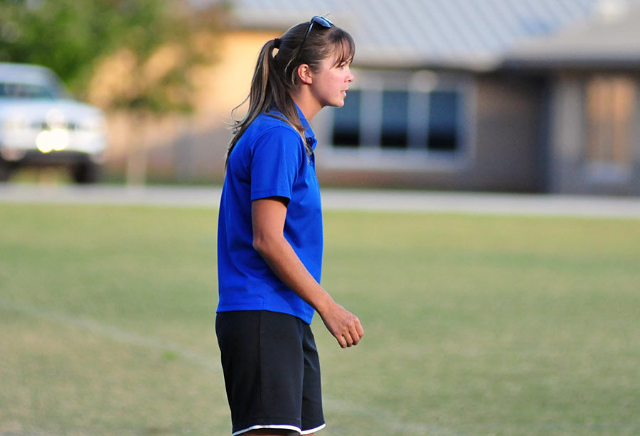 Polk County Middle assistant coach Stephanie Luedi directs the team during the second half Monday.