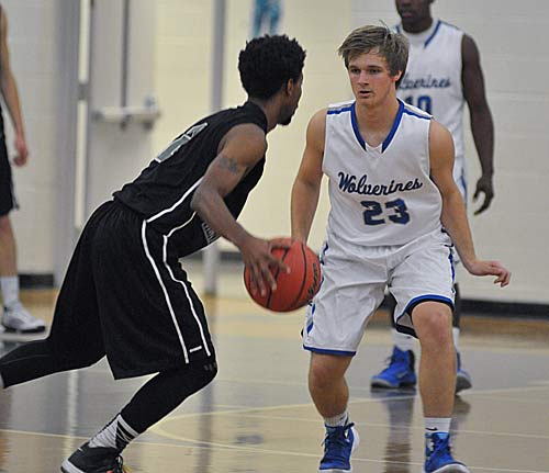 Polk County's Holden Owens looks to deny an East Henderson entry pass.