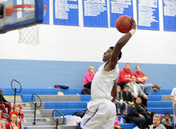 Jamal Wheeler soars in for one of his two dunks in Friday's game.
