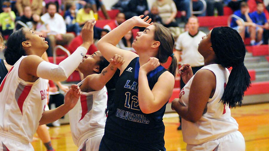 Polk County's Alana Seay scores two points in early action Tuesday.