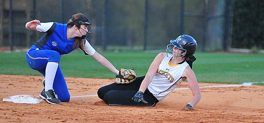 Taking a throw from Ansley Lynch in the outfield, Haley Fowler tags out a Union runner at third.