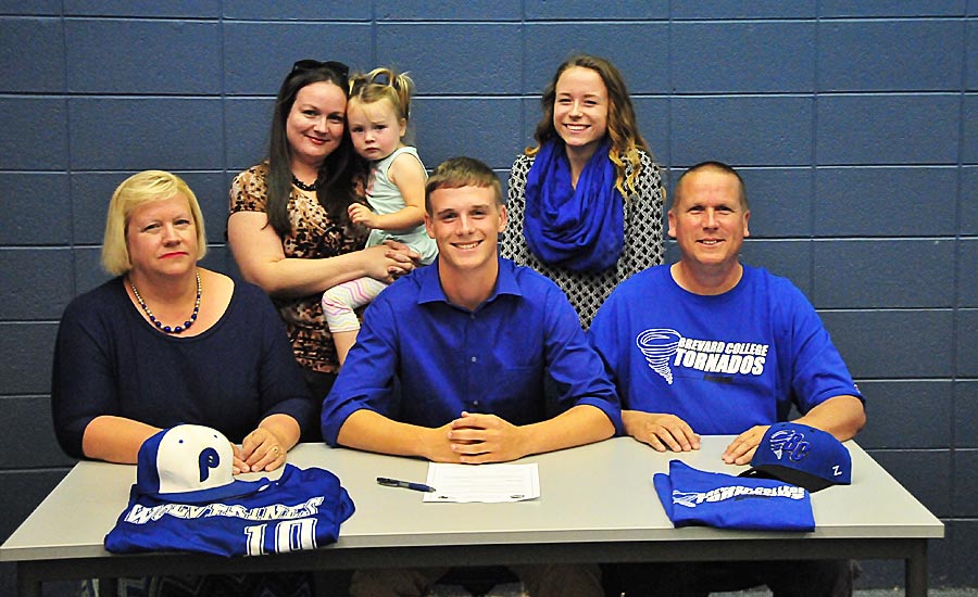 In attendance at Thursday's signing were, front row, from left, Pallas Edwards, J.D. Edwards, David Edwards. Back row, from left, Hilary Edwards, Kaydence Cole, Hope Edwards.