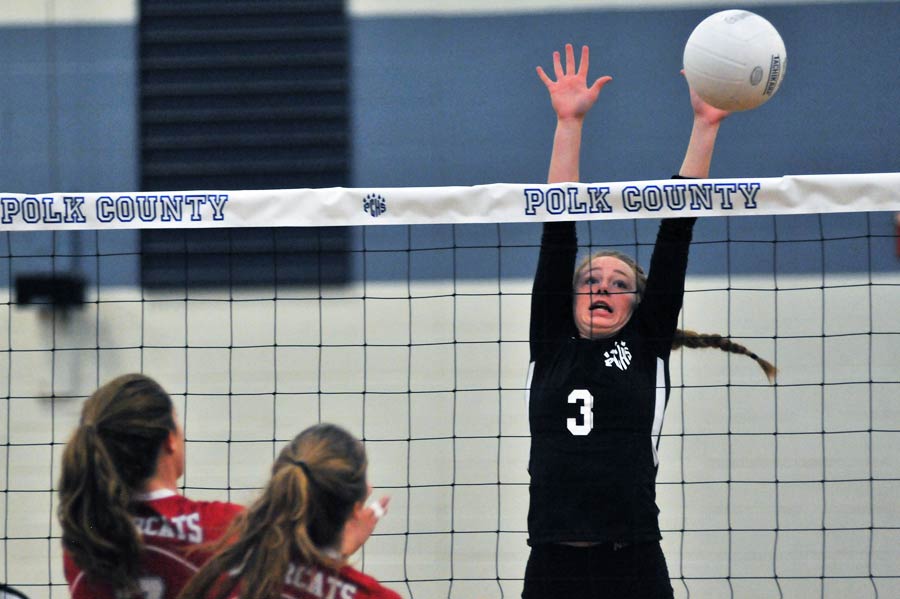 Ansley Lynch reaches to block a Hendersonville shot during Thursday's match.