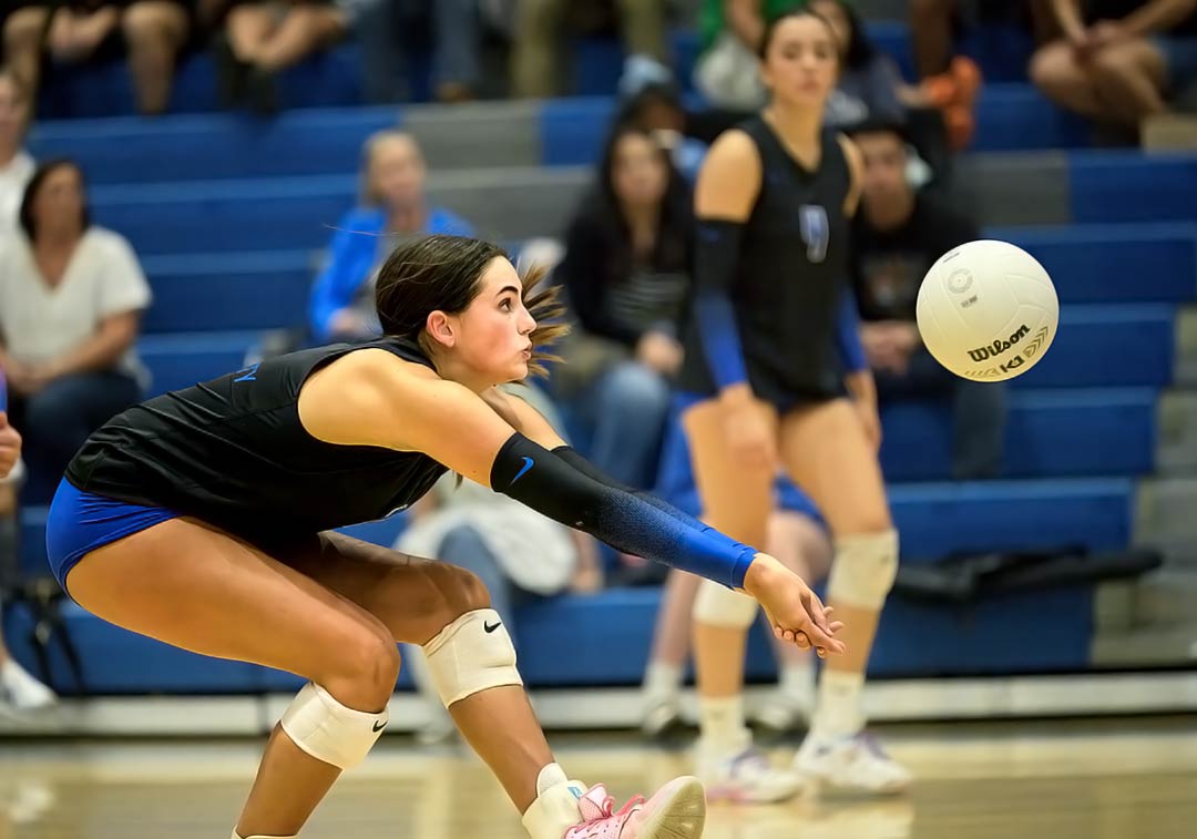 Morgan Yoder dips for one of her 12 digs during Wednesday's win over R-S Central