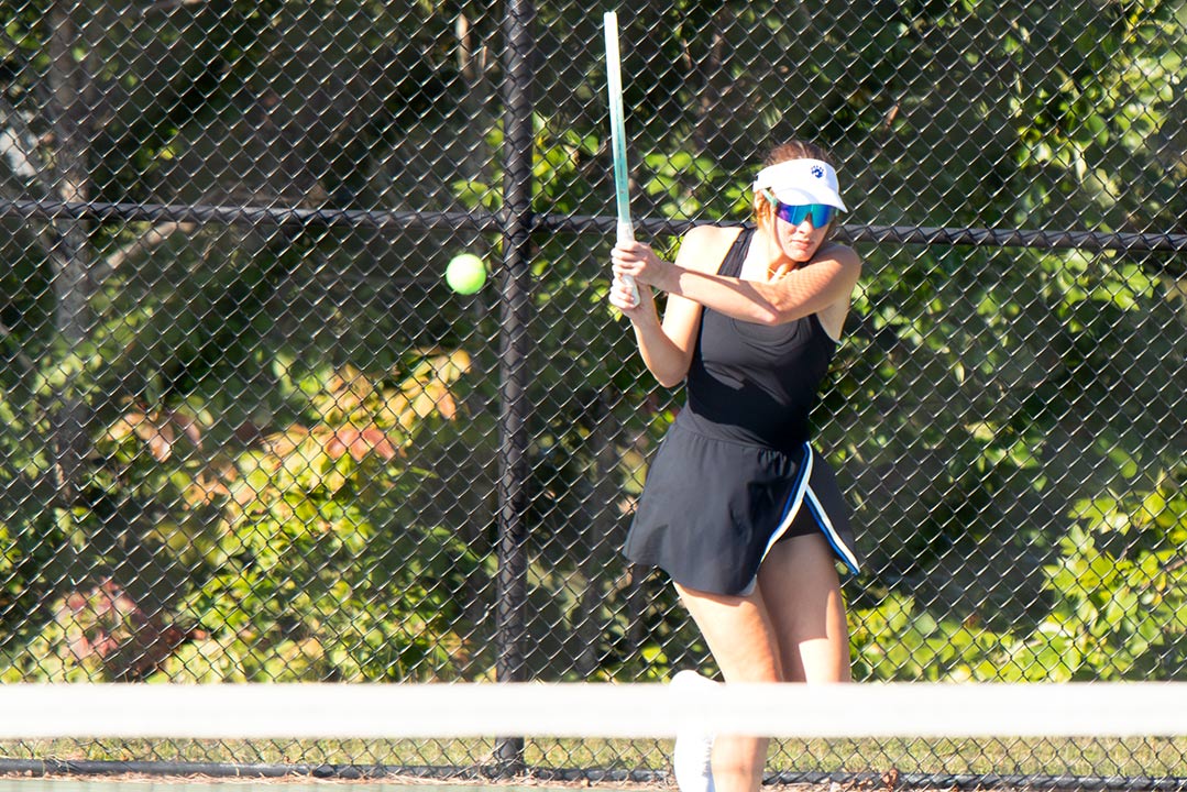 Tali Thompson delivers a backhand return during her singles match Tuesday against East Rutherford