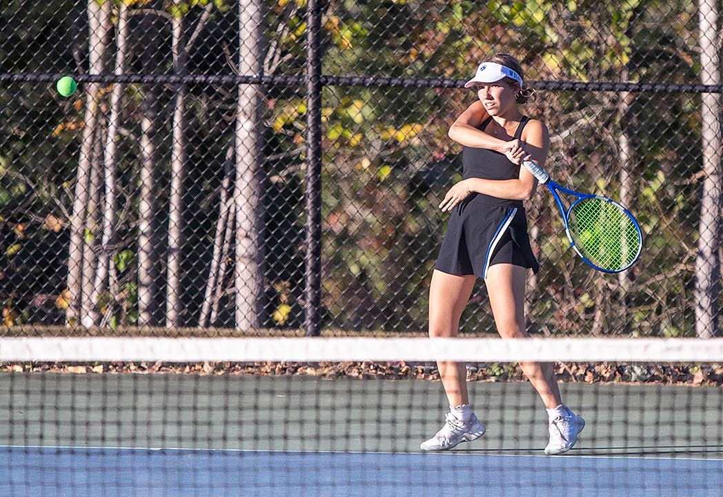 Polk County's Mia Wolfe watches a forehand return sail across court during Wednesday's match