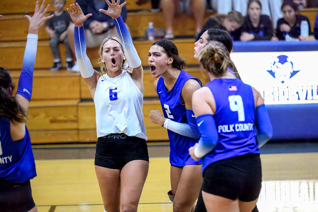 Sophia Overholt (2) leads a Polk County celebration following a point in Thursday's match