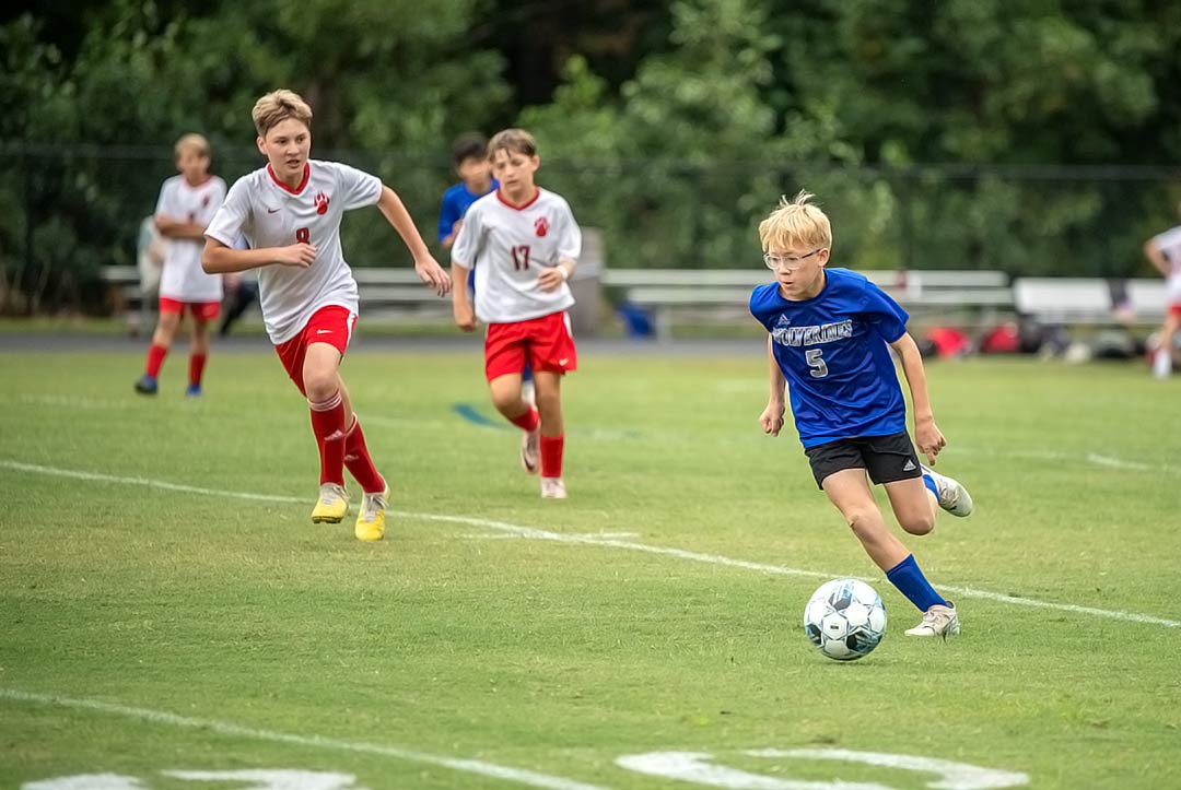 Polk Middle's Alec Fine and the Wolverines completed Tuesday a season sweep of Hendersonville Middle