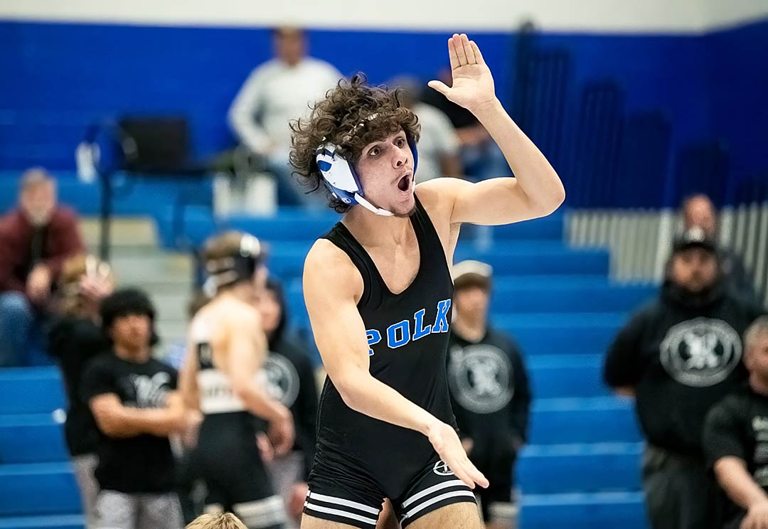 Polk County's Amon Villarreal celebrates after his win Wednesday at 126 pounds