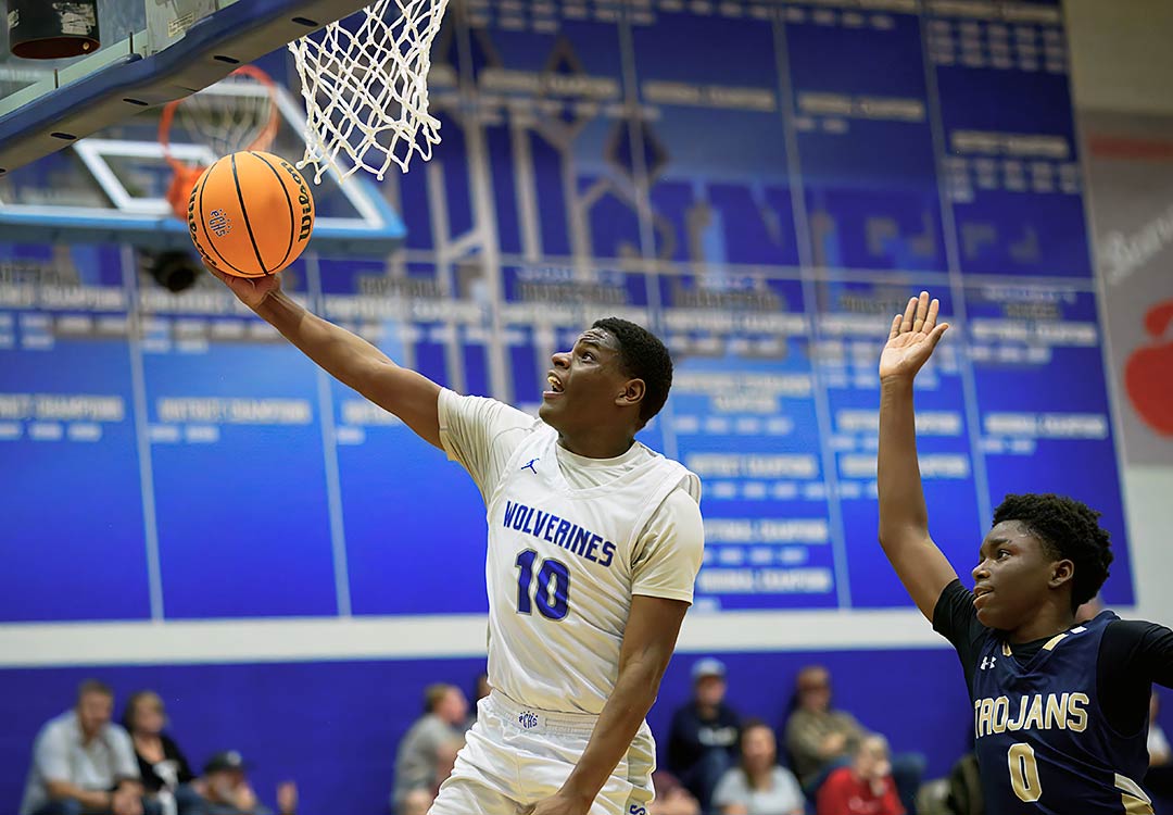 Polk County's Khalil Austin soars to the basket during the second half of Friday's game