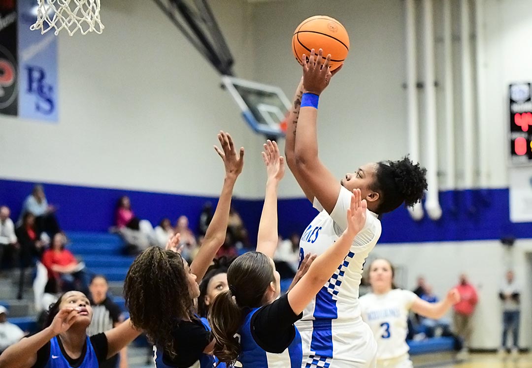 Polk County's Kiera Littlejohn rises above R-S Central's defense for a shot during Tuesday's game