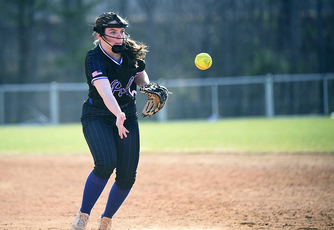 Polk County second baseman Aslyn Scruggs flips the ball to first to retire an East Henderson runner in Saturday afternoon's game