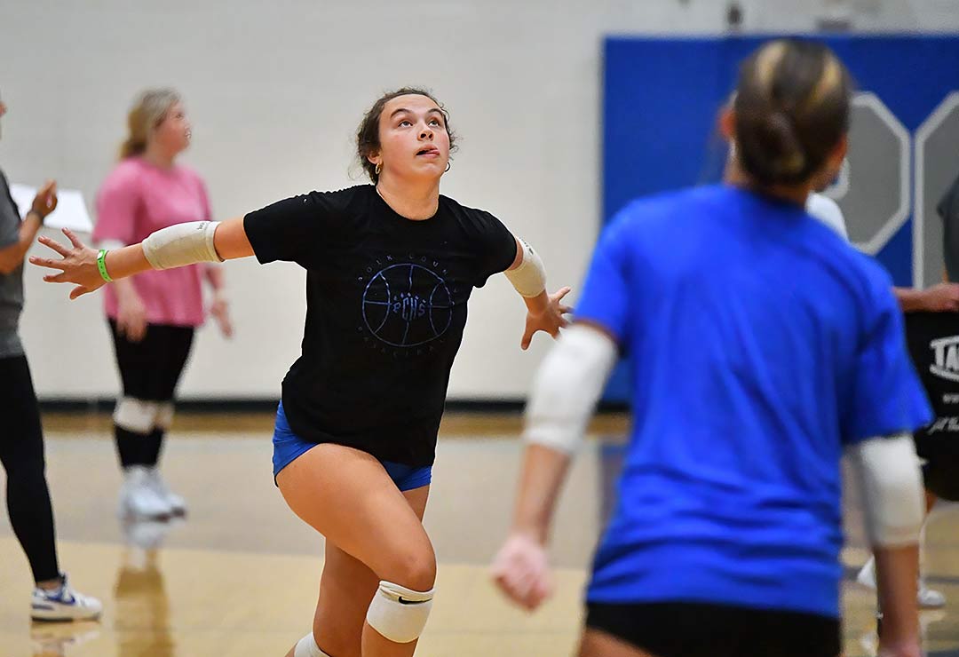 Polk County's Beija Olivari focuses on a set during Wednesday's afternoon practice