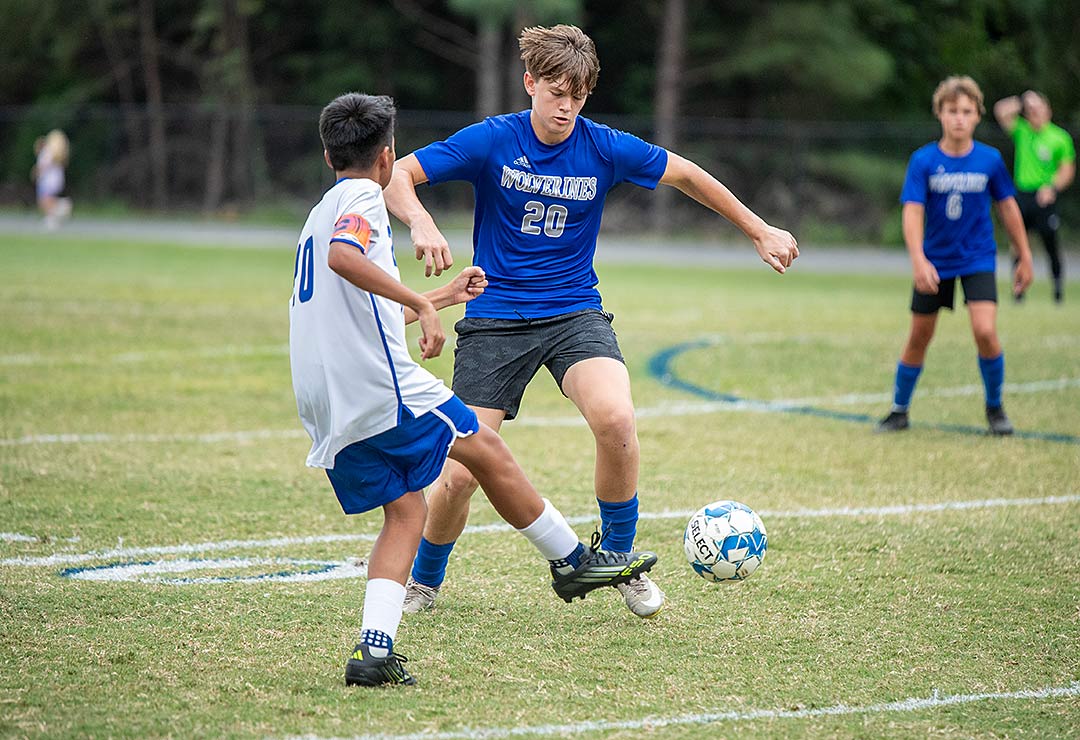 Polk Middle's Callaway Cameron works to gain possession during the first half of Wednesday's match