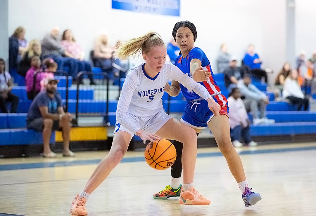 Polk County Middle's Emily Dotson drives to the basket during the first half of Thursday's game