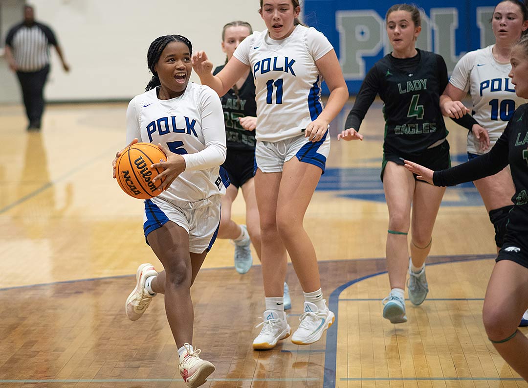 Polk County's Audy Simmons steams toward the basket during Tuesday's action