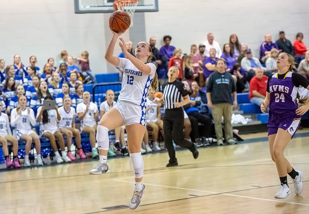 Polk Middle's Kenzie Alm soars in for the winning basket Wednesday as the Wolverines defeated Apple Valley