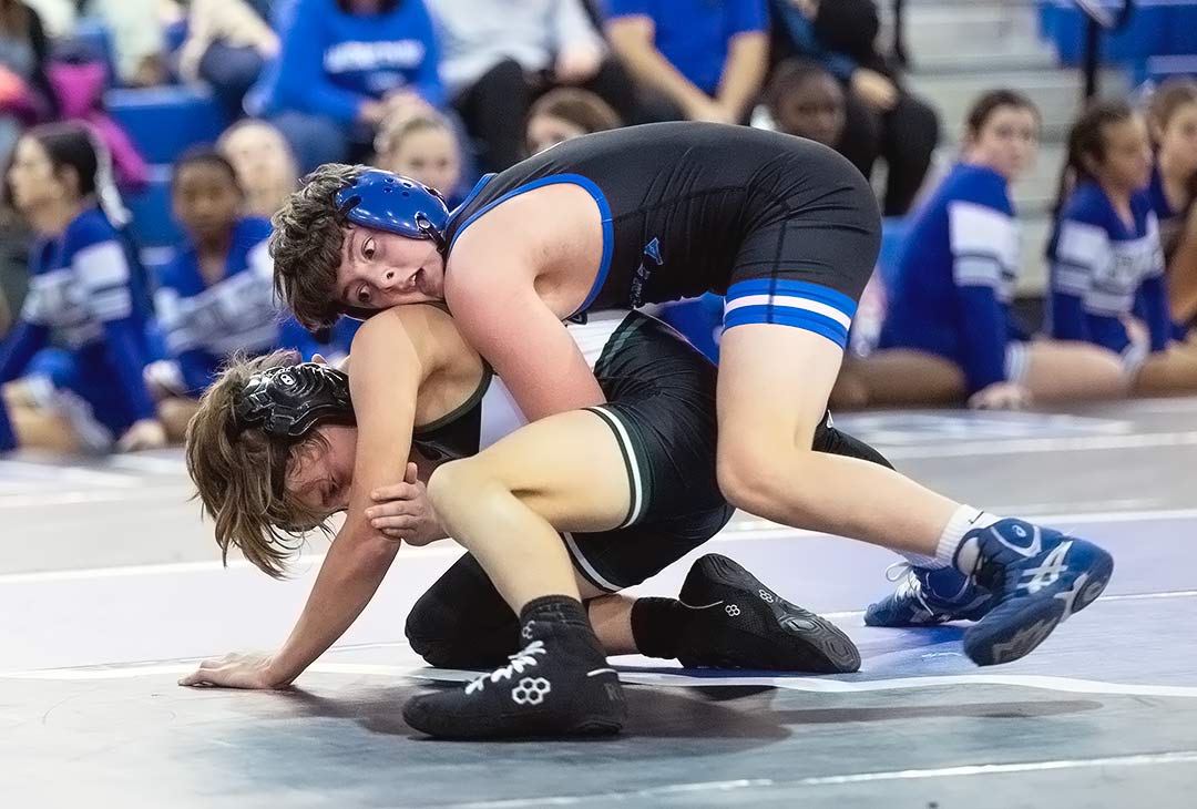 Polk Middle's Jace Morgan battles Thursday in his match at 106 pounds