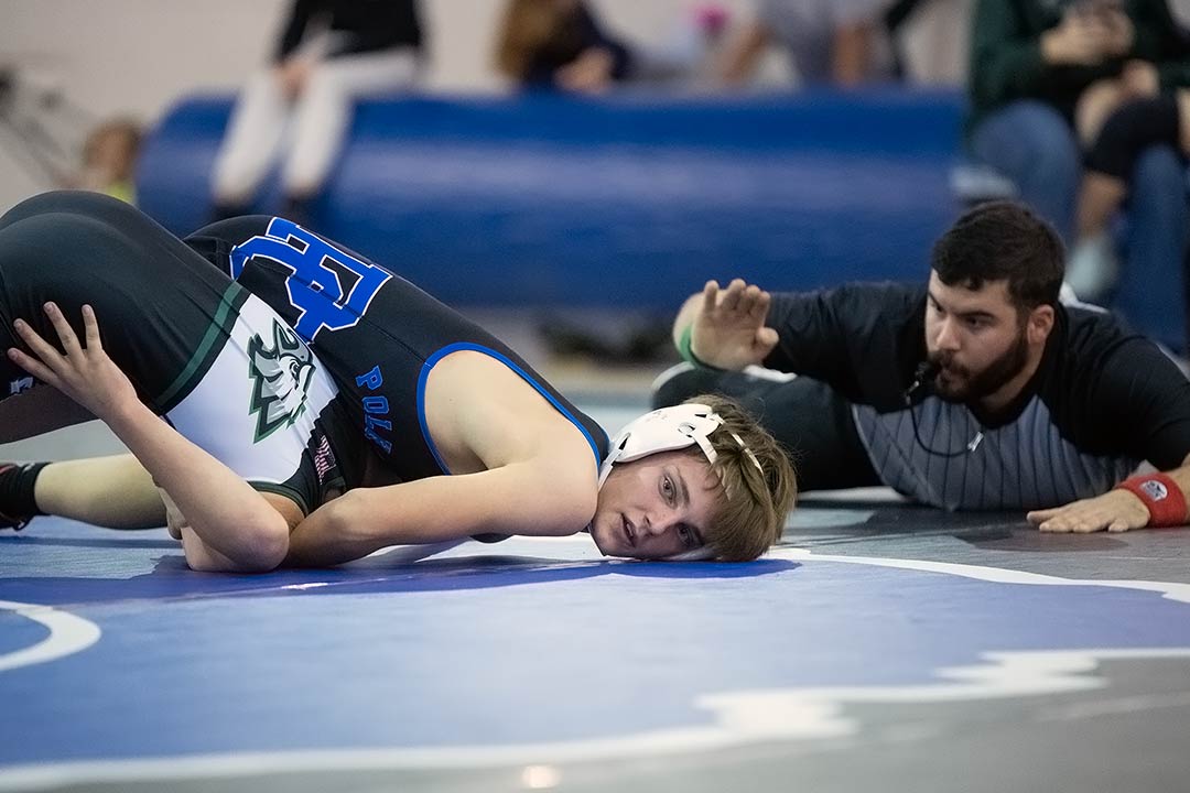 Polk Middle's Rhys Jackson was one of the Wolverines to win Thursday by pin
