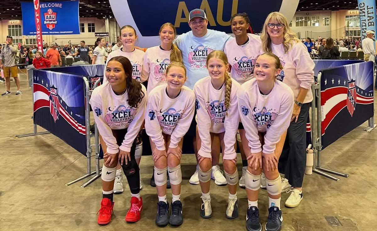 Polk County's Alia Vorbe (front left) and Kenzie Alm (front right) competed with Xcel Volleyball Performance's 14 Aspire team at the AAU national tourney (photo courtesy Brandy Alm)