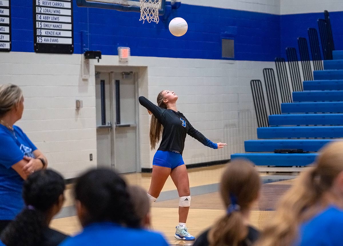Polk County's ScottLynn Whiteside serves in a recent match