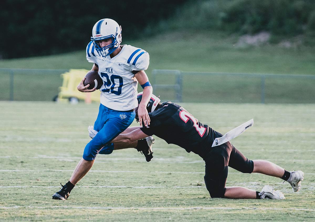 Polk County's Matthew Sokil avoids a Landrum tackler (Caleb Russell photo)