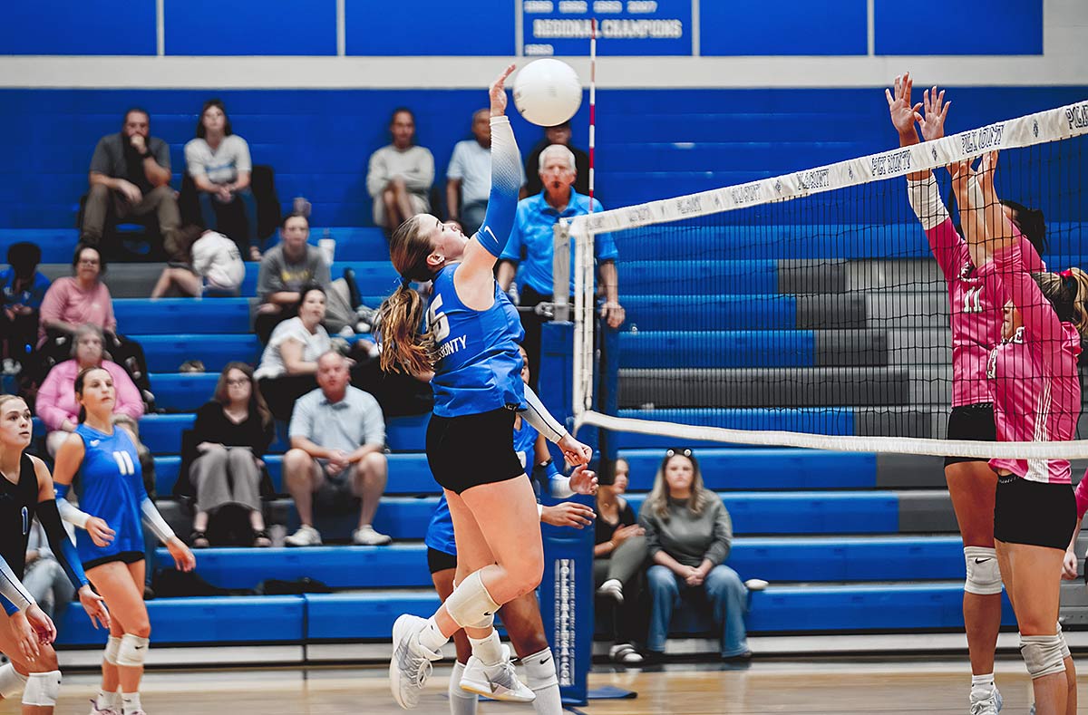 Polk County's Kenzie Alm reaches for a kill during Tuesday's match (Caleb Russell photo)