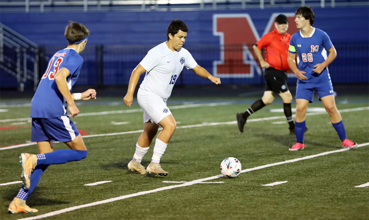 Polk County's Juan Vazquez helps stop a Madison surge during Monday's match (photo courtesy Kate Meyer)