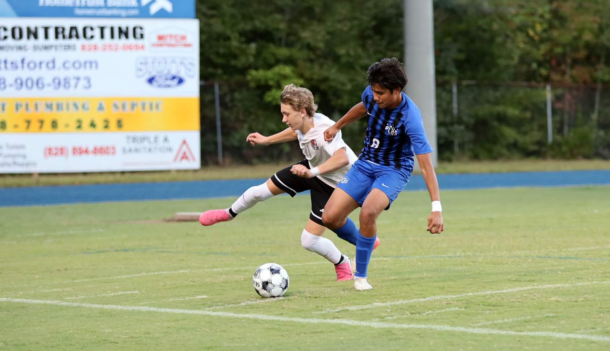 Polk County's Erik Ramirez works to gain possession during Monday's match (photo courtesy Kate Meyer)