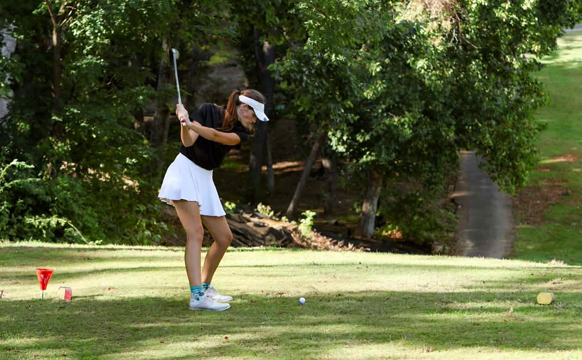 Polk County's Addie Buss tees off during Monday's match (photo courtesy Lindy Buss)